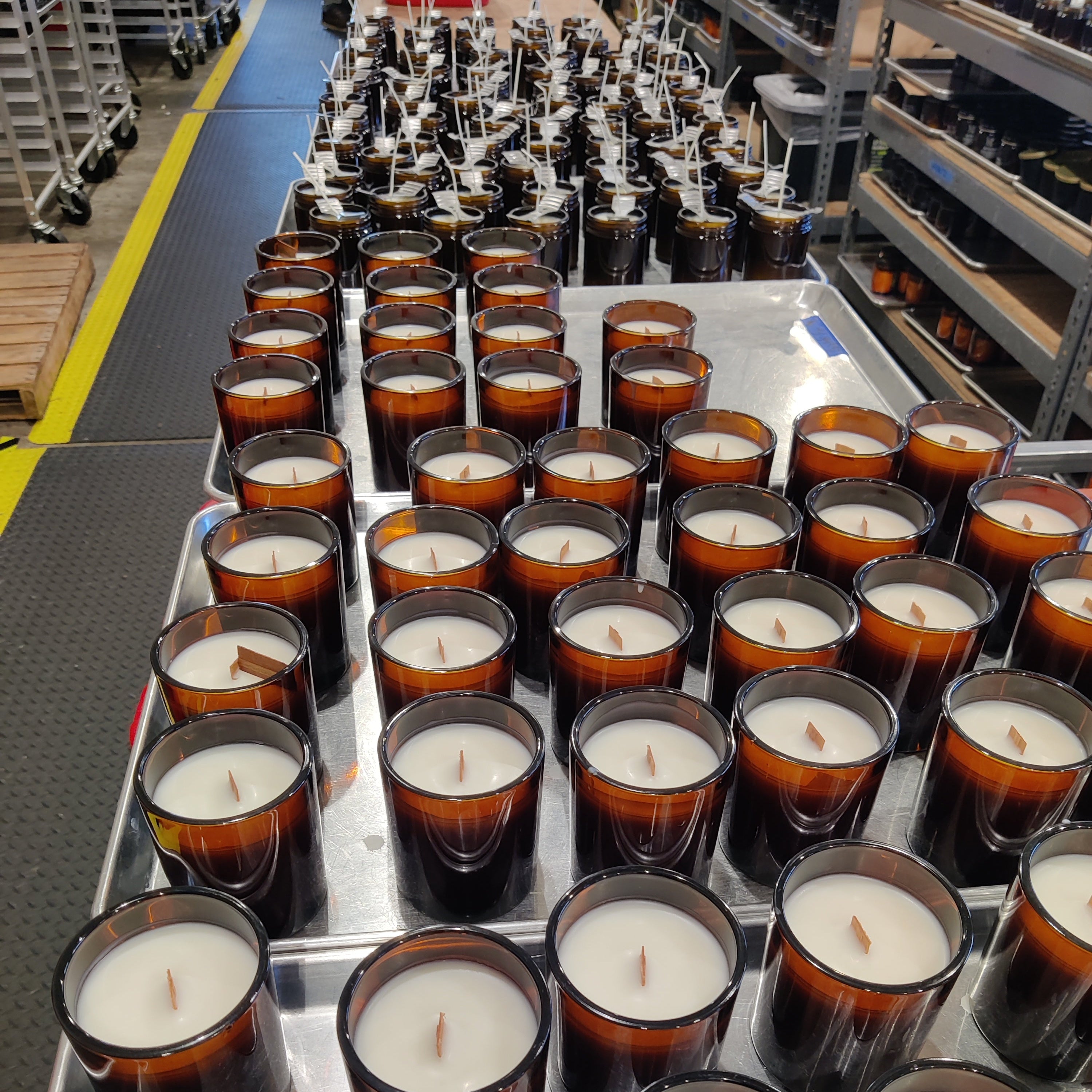 Rows of candles on a production line in Resistance Candles' factory in Washington