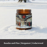 Liberty Tree candle that smells like basalm, pine, bergamot, and cedarwood